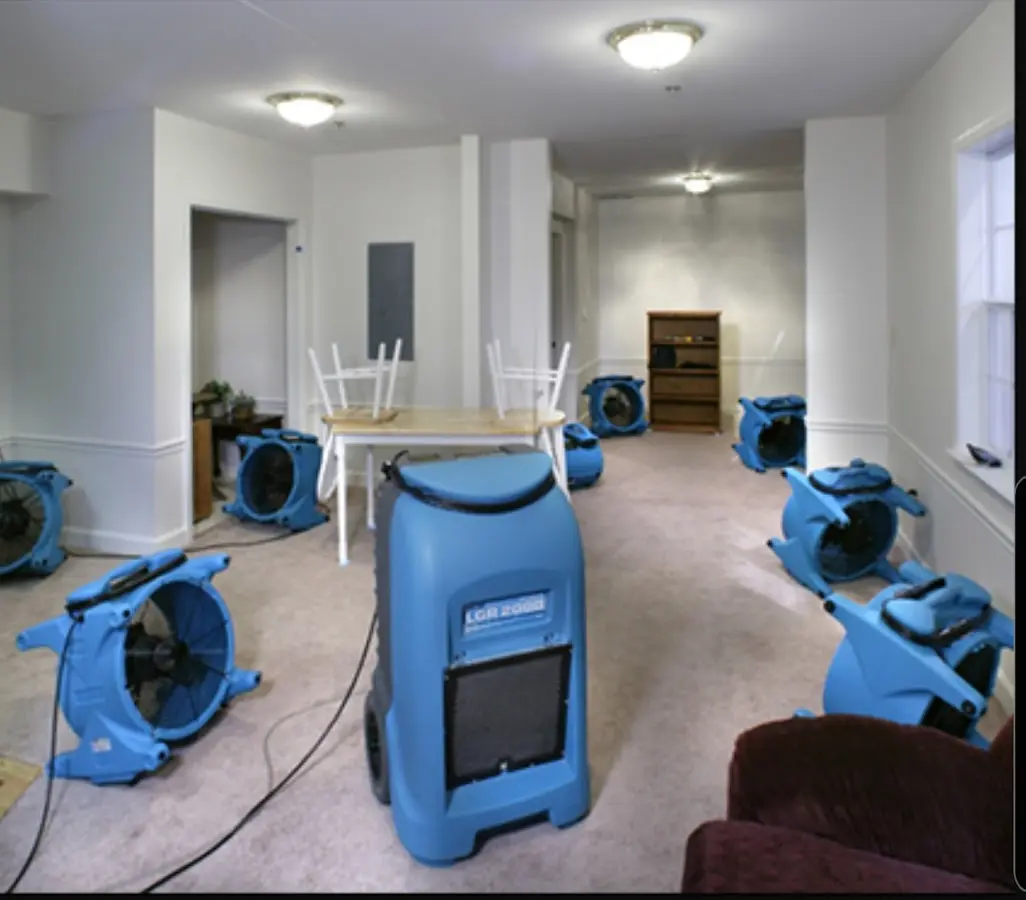 Air movers and dehumidifier setup for Water Damage Restoration in Covington